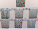 Sims 4 — Towel Rack Floral by Surfkitten — Base game towel rack recolored with floral patterns and recolored accents.